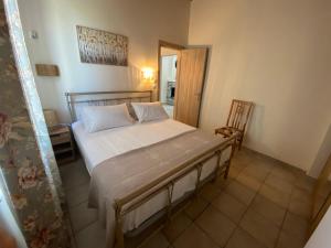 Кровать или кровати в номере Aphrodite Apartments