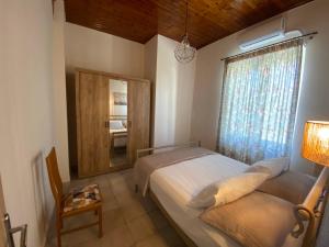 Кровать или кровати в номере Aphrodite Apartments