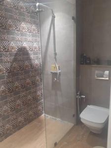 a bathroom with a shower and a toilet at Dar Douja / Grandview Waterfront Duplex / Four seasons in Sfax