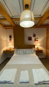 Кровать или кровати в номере “La Carpintería”