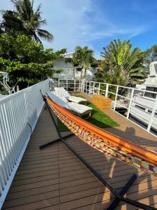 a hammock on the deck of a boat at Unique Houseboat Modern and New in Fort Lauderdale