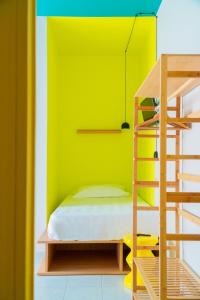 A bed or beds in a room at Hotel Belvedere Rimini