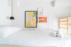 A bed or beds in a room at Hotel Belvedere Rimini