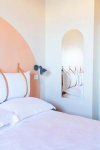 A bed or beds in a room at Hotel Belvedere Rimini