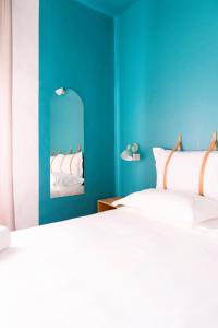 A bed or beds in a room at Hotel Belvedere Rimini