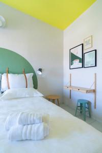 A bed or beds in a room at Hotel Belvedere Rimini