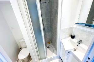 a bathroom with a shower and a sink and a toilet at Terrasse 360° avec vue sur vallée, sans vis à vis in Poussan +19 photos
