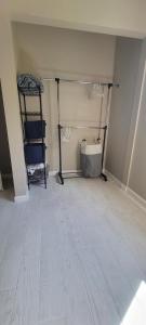a room with a white floor and a room with shelves at Cute Brand New Home near Tampa Bay-Vicenza Home in Riverview