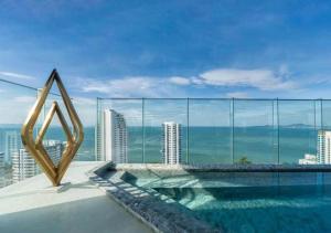 a swimming pool on the roof of a building at The Panora Pattaya in Pattaya South