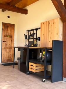 a kitchen with a counter and a wooden door at RIP by Říp in Krabčice