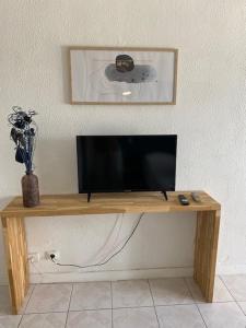 TV a/nebo společenská místnost v ubytování Résidence de la Baie