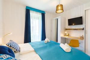 Postel nebo postele na pokoji v ubytování Blue4 Apartment