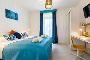 Postel nebo postele na pokoji v ubytování Blue4 Apartment