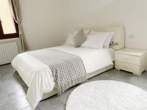 Ένα ή περισσότερα κρεβάτια σε δωμάτιο στο Gris Apartment: Venice Mestre