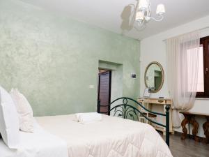 En eller flere senger på et rom på Villa Grace Tombolato