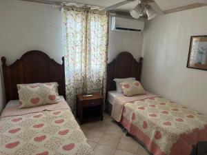 Postel nebo postele na pokoji v ubytování Beach Life Villa