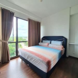 Voodi või voodid majutusasutuse Homey 1BR Condo Marigold Navapark BSD Full Furnish toas