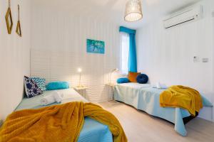 Postel nebo postele na pokoji v ubytování Blue4 Apartment