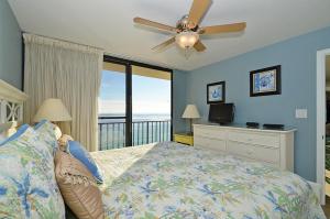 a bedroom with a bed and a ceiling fan at One Seagrove Place 0908 in Santa Rosa Beach +44 photos