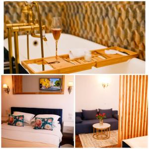 een hotelkamer met een bed en een glas wijn bij Joseph Hayn Apartments in Sighişoara
