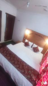 Letto o letti in una camera di THE Q2 RESIDENCY