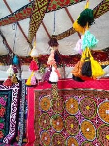 a group of tassels hanging from the top of a tent at Юрта 6-канатная in Türgen