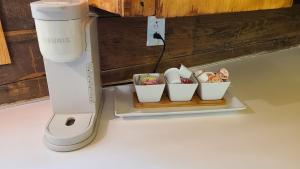 a food processor and three bowls of food on a tray at Back in time 1940s Lakeview House in South Toledo Bend