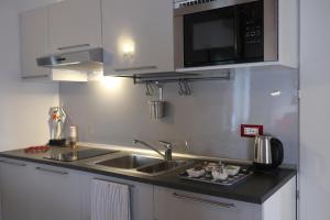 Kuchyň nebo kuchyňský kout v ubytování Holiday Home Giaron