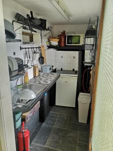 Kuchyň nebo kuchyňský kout v ubytování Sweet Tiny House + 22 fotografií