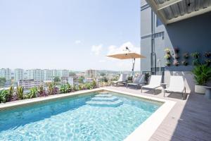 a swimming pool on the roof of a building at Casco View By Wynwood House in Panama City