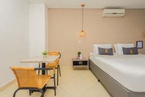 Voodi või voodid majutusasutuse Hotel Perlatto toas