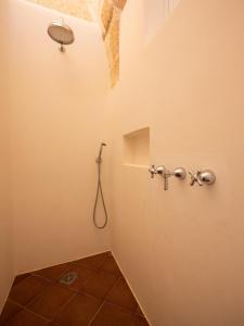 a bathroom with a shower and a toilet at le CASINE di MARUGGIO 19 in Maruggio