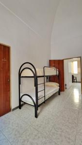 a bedroom with two bunk beds in a room at Economy Guest House in Gallipoli +12 photos