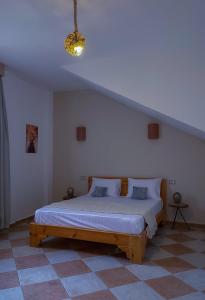 a bedroom with a large bed in a room at Lighthouse Apartment in Dahab