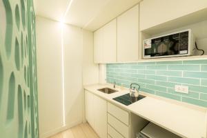 Kuchyň nebo kuchyňský kout v ubytování Hotel Nova