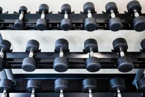 a bunch of black dumbbells on a rack at TownePlace Suites Gaithersburg in Gaithersburg +31 photos
