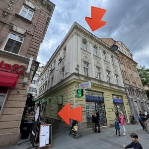 a building with orange arrows on the side of it at Your Room in Sarajevo