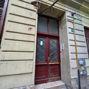 a red door on the side of a building at Your Room in Sarajevo +4 photos