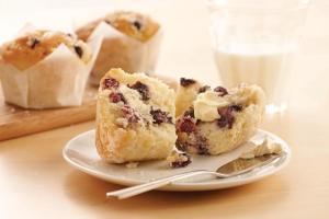 a piece of blueberry muffin on a plate with a spoon at TownePlace Suites Gaithersburg in Gaithersburg