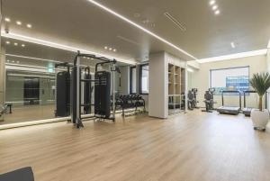 a gym with exercise equipment in a building at 대구 수성 더 아르코 호텔 라이온즈파크점 