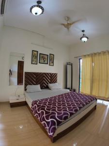 Postel nebo postele na pokoji v ubytování Gold Villa