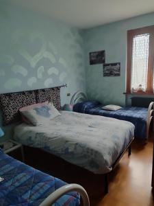 Postel nebo postele na pokoji v ubytování B&B La Dea