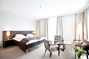 Postel nebo postele na pokoji v ubytování Bryne Hotell