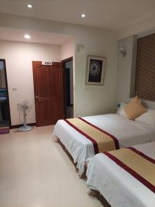 Rúm í herbergi á Penghu Luna Sea Homestay