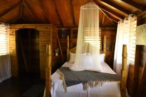 Krevet ili kreveti u jedinici u objektu Somali Jungle Eco Lodge and Cabins