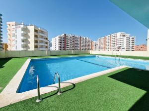 a swimming pool on the roof of a building at Apartments Edifício Cruzeiro in Portimão