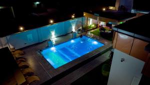 an overhead view of a swimming pool at night at Mboka Village in Kahama