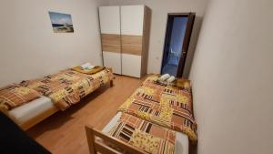 Кровать или кровати в номере Apartment Ajdukovic