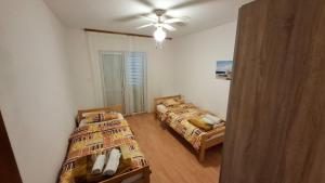 Кровать или кровати в номере Apartment Ajdukovic