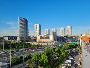 a city skyline with tall buildings and a highway at El Emin İstanbul Hotel in Istanbul